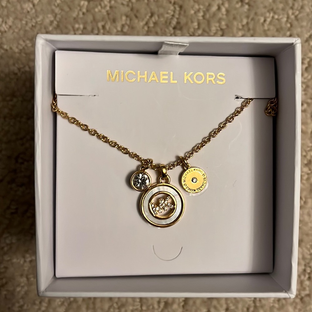 Michael Kors charm necklace, gold tone, new in box